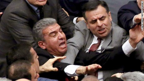 Ruling Justice and Development Party and main opposition Republican People&#39;s Party lawmakers scuffle at the parliament in Ankara during deliberations over a controversial 18-article bill to change the constitution to create an executive presidency January 11, 2017.
Turkish lawmakers on Thursday approved three more articles in a hugely controversial bill bolstering the powers of President Recep Tayyip Erdogan, as lawmakers brawled and threw objects in a session of high tension. A brawl erupted in the chamber as the voting took place in an overnight session, with lawmakers punching each another and chairs being thrown, television pictures showed.  / AFP / -        (Photo credit should read -/AFP/Getty Images)