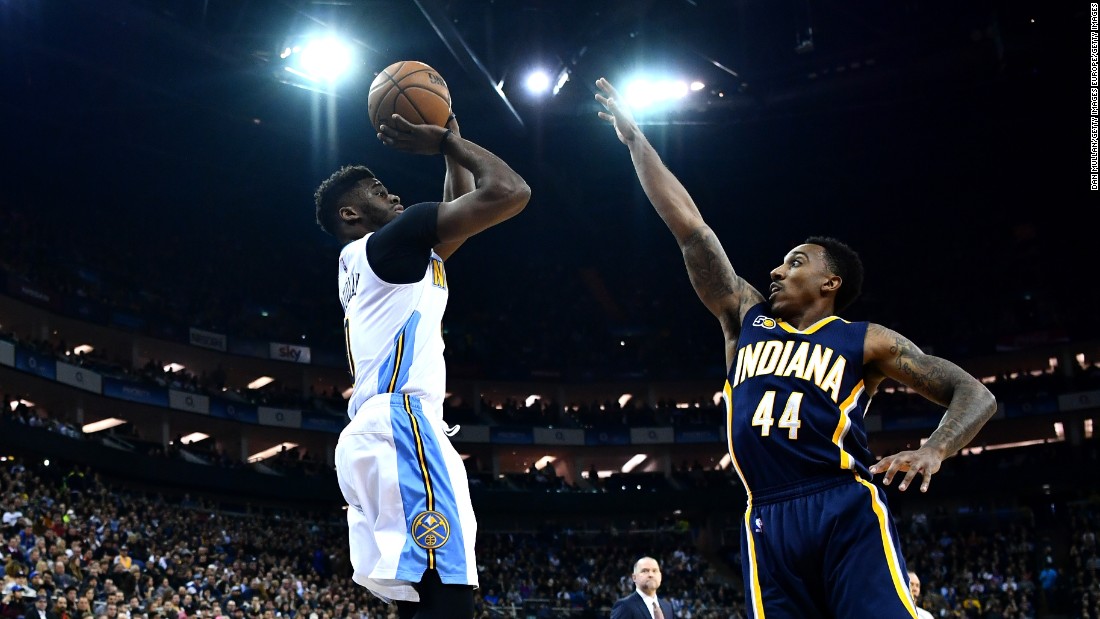 Pacers&#39; Jeff Teague tries to block Emmanuel Mudiay of the Nuggets under the lights of London&#39;s O2 Arena. 