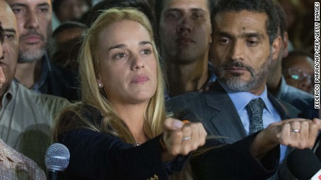 The wife of jailed opposition leader Leopoldo Lopez, Lilian Tintori (C), reacts during press conference in Caracas on September 10, 2015. Jailed Venezuelan opposition leader Leopoldo Lopez was sentenced to nearly 14 years in prison for inciting violence during deadly protests in 2014. The popular dissident, a US-trained economist who has been held at a military prison since February 2014, is accused of inciting violence against the government of President Nicolas Maduro and attempting to force his ouster. AFP PHOTO/ FEDERICO PARRA        (Photo credit should read FEDERICO PARRA/AFP/Getty Images)