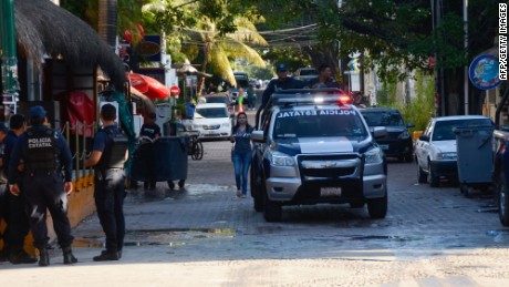 Mexican police agents patrol near a nightclub in Playa del Carmen, Quintana Ro state, Mexico where 5 people were killed, three of them foreigners, during a music festival on January 16, 2017.
A shooting erupted at an electronic music festival in the Mexican resort of Playa del Carmen early Monday, leaving at least five people dead and sparking a stampede, the mayor said. Fifteen people were injured, some in the stampede, after at least one shooter opened fire before dawn at the Blue Parrot nightclub during the BPM festival.


 / AFP PHOTO / STRSTR/AFP/Getty Images