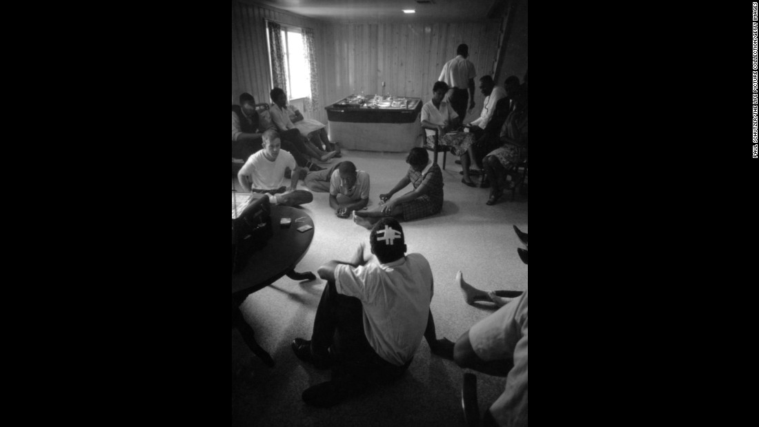 Lewis, with his head bandaged, relaxes with fellow Freedom Riders at a safe house in Montgomery.