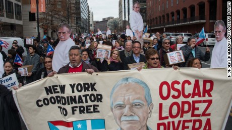 People march to demand the release of Puerto Rican nationalist Oscar Lopez Rivera near the White House in Washington, DC, on January 11, 2017, shortly before Obama commuted his sentence.