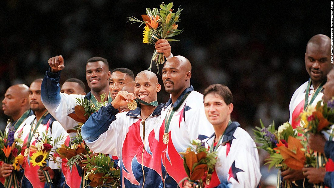 The &quot;Dream Team&#39;s&quot; Reggie Miller, center, flashes his gold medal surrounded by other members of the US men&#39;s basketball team during the medal presentation at the 1996 Summer Olympics. Standing, from left, are Charles Barkley, Grant Hill, Penny Hardaway, David Robinson, Scottie Pippen, Miller, Karl Malone, John Stockton and Shaquille O&#39;Neal.