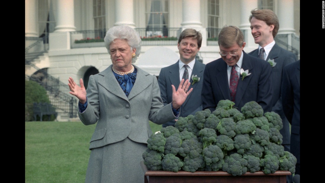 The first lady accepts three cases of broccoli from a California grower&#39;s association during a ceremony at the White House in Washington. The group shipped a total of 10 tons of broccoli after President Bush proclaimed his dislike for the vegetable. The remaining broccoli went to area food banks.