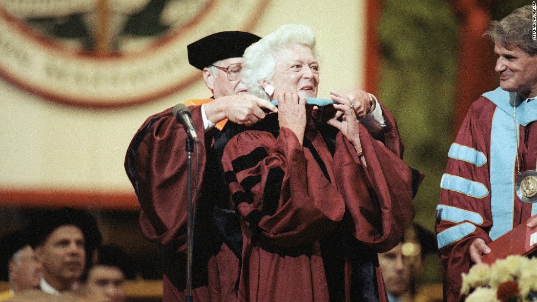 Barbara Bush has a doctoral hood placed over her shoulders during Northeastern University&#39;s spring commencement on June 15, 1991. Bush was the commencement speaker and recipient of an honorary doctorate for public service.