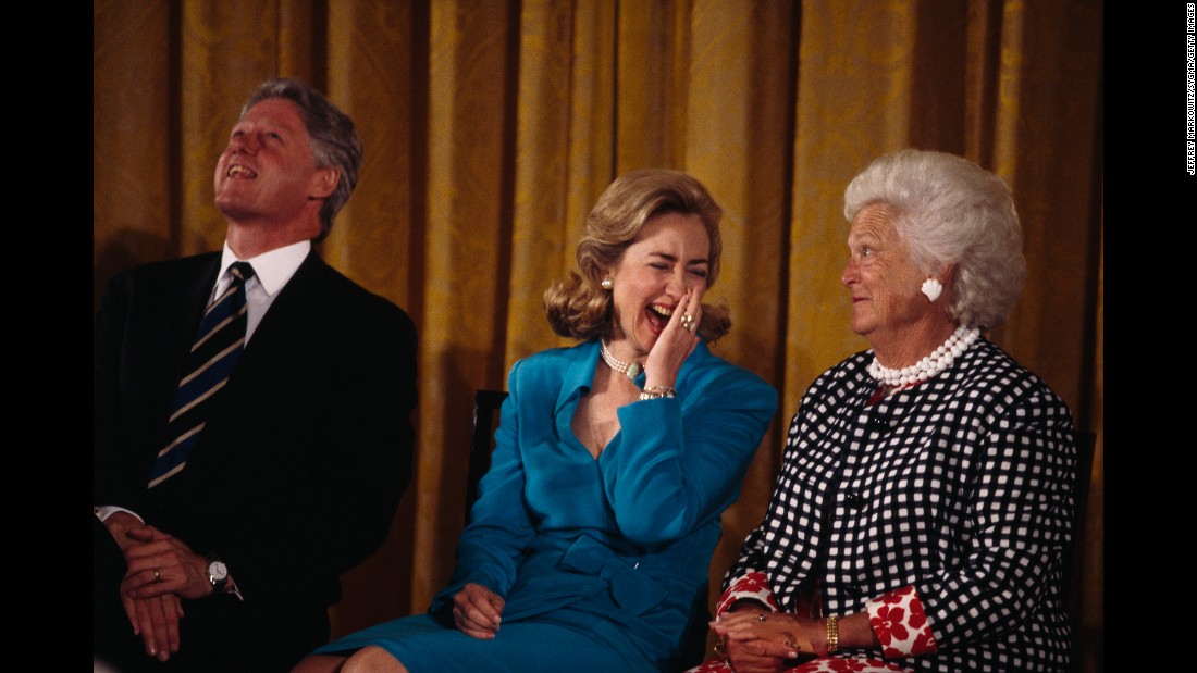 Bush sits beside Bill Clinton and his wife, Hillary. Bill Clinton, the 42nd President of the United States, defeated George H.W. Bush in the 1992 presidential election.