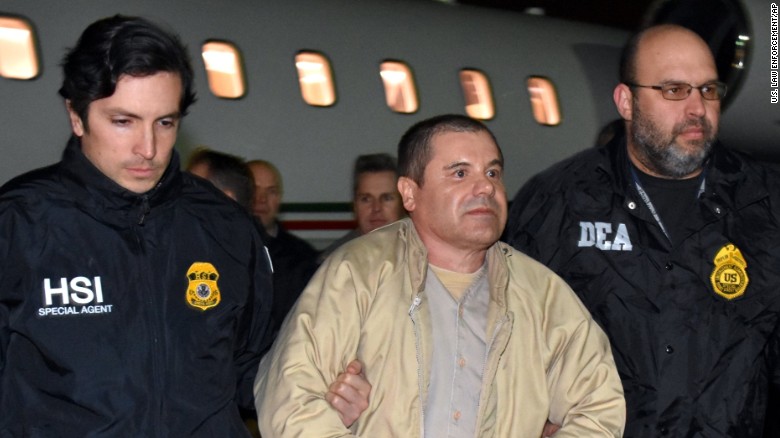 US authorities escort Joaquin &quot;El Chapo&quot; Guzman on Thursday at a Long Island, New York, airport.