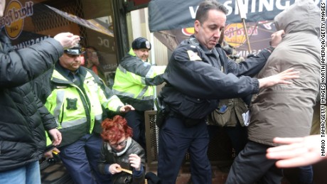 WASHINGTON, DC - JANUARY 20:  Protesters scuffle with police during an anti-Trump demonstration on January 20, 2017 in Washington, DC. Protesters attempted to block an entrance to the inauguration ceremony. President-elect Donald Trump will be sworn in as the 45th U.S. President later today.  (Photo by Mario Tama/Getty Images)