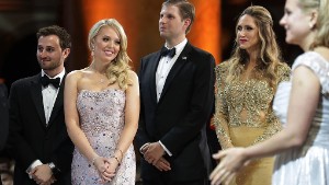 WASHINGTON, DC - JANUARY 20:  (L-R) Tiffany Trump (2nd L) and her guest Ross Mechanic (L), and Eric Trump and his wife Lara Yunaska watch as U.S. President Donald Trump cuts a cake during the inaugural Armed Services Ball at the National Building Museum January 20, 2017 in Washington, DC. The ball is part of the celebrations following the inauguration of Trump.  (Photo by Chip Somodevilla/Getty Images)