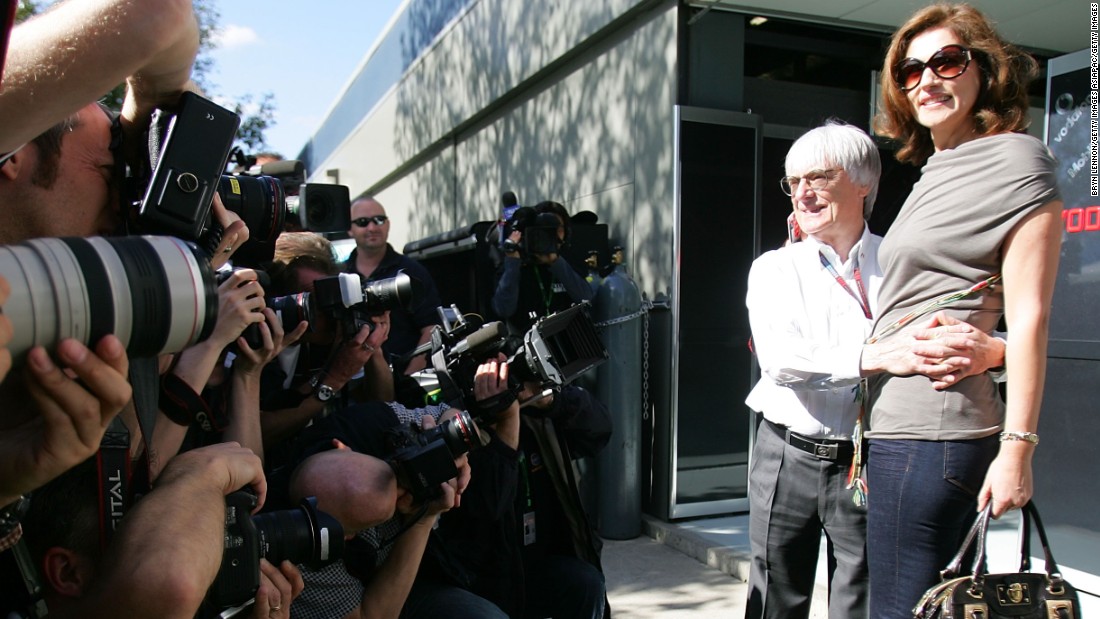 He faces the camera with her at the Australian Grand Prix in 2007.