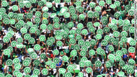 Chapecoense&#39;s supporters cheer before a friendly football match against Palmeiras -Brazilian Champion 2016- at the Arena Conda stadium in Chapeco, Santa Catarina state, in southern Brazil on January 21, 2017. 
Most of the members of the Chapocoense football team perished in a November 28, 2016 plane crash in Colombia. / AFP / NELSON ALMEIDA        (Photo credit should read NELSON ALMEIDA/AFP/Getty Images)