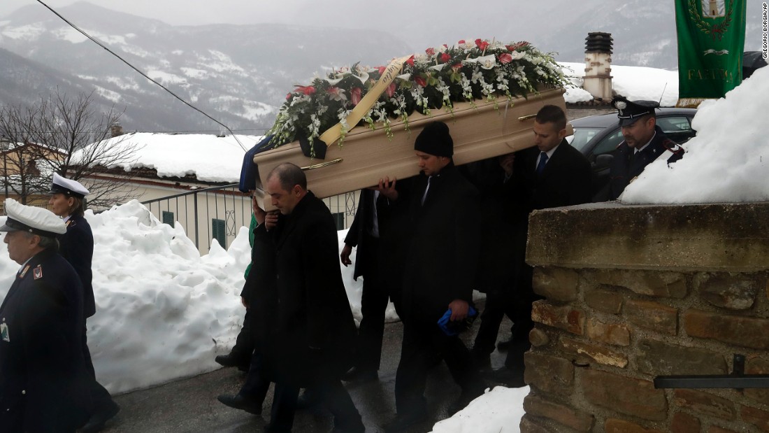 The coffin of avalanche victim Alessandro Giancaterino is carried to his funeral service in Farindola, central Italy, on Tuesday, January 24. A series of earthquakes that struck on January 18 caused an avalanche at the foot of Gran Sasso mountain in central Italy, about 135 kilometers (85 miles) northeast of Rome, burying guests and staff of Hotel Rigopiano, a local mountain resort.