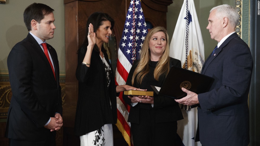 South Carolina Gov. Nikki Haley takes the oath of office as she becomes the US Ambassador to the United Nations on Wednesday, January 25. She is joined by US Sen. Marco Rubio and staffer Rebecca Schimsa as she is sworn in by the vice president.