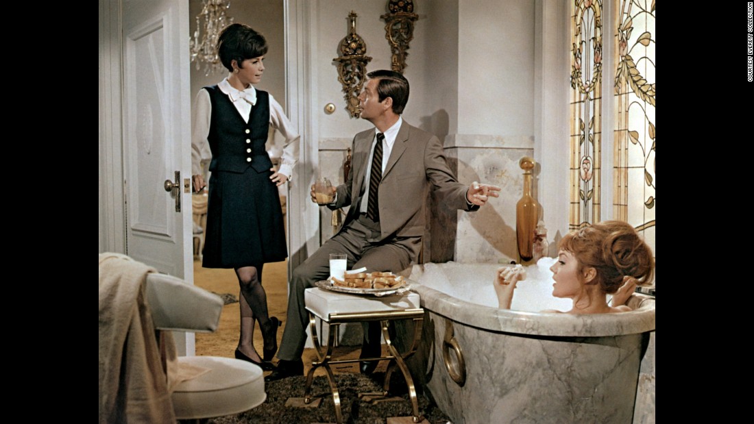 Moore, Robert Wagner and Barbara Rhoades, right, appear in the 1968 film &quot;Don&#39;t Just Stand There!&quot;