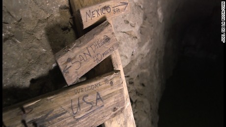 A makeshift distance marker in a tunnel wryly gives some vital distance numbers.