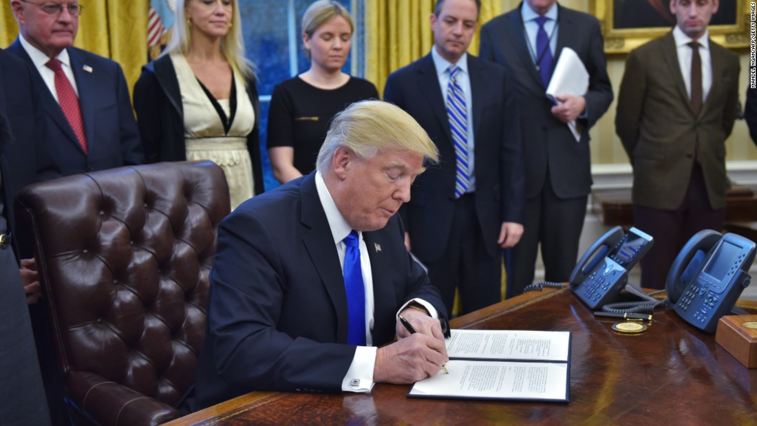 Image result for photo of president trump signing travel ban