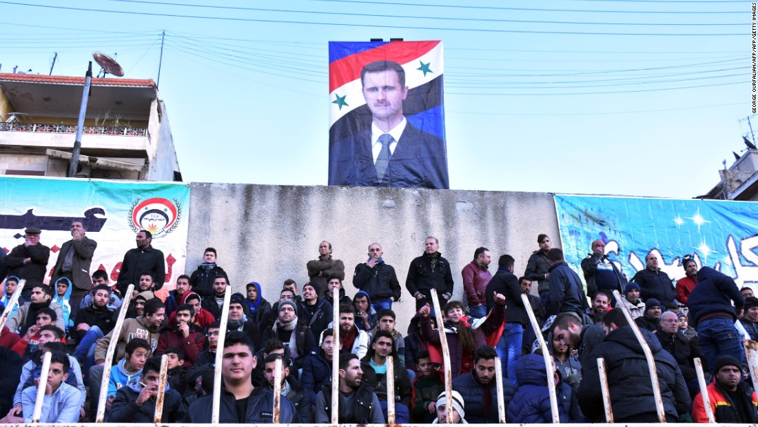 As did a poster of Syrian President Bashar al-Assad, which loomed over the stands.