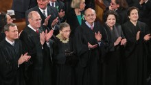 WASHINGTON, DC - FEBRUARY 12: Members of the Supreme Court, (L-R) Chief Justice John Roberts and associate justices Anthony Kennendy, Ruth Bader Ginsburg, John Paul Stevens, Sonia Sotomayor and Elena Kagan, applaud as U.S. President Barack Obama arrives to deliver his State of the Union speech before a joint session of Congress at the U.S. Capitol February 12, 2013 in Washington, DC. Facing a divided Congress, Obama focused his speech on new initiatives designed to stimulate the U.S. economy and said, 'It?s not a bigger government we need, but a smarter government that sets priorities and invests in broad-based growth'. (Photo by Chip Somodevilla/Getty Images)