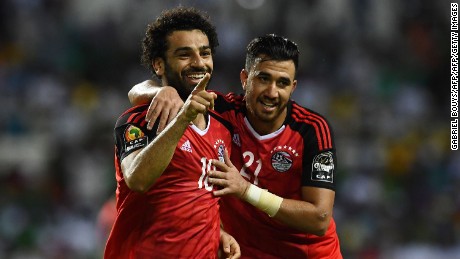 Salah (L) celebrates with Egypt's midfielder Mahmoud Hassan after scoring a goal during the 2017 Africa Cup of Nations.    