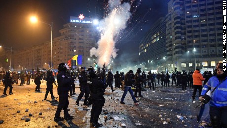Romanian riot police fire tear gas to disperse people taking part in the protests on Wednesday.