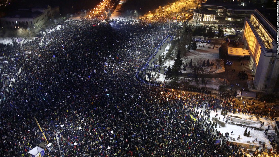 Protesters crowded in front of government headquarters in Bucharest on February 1,  demonstrating against the passage of a law that would decriminalize corruption. 