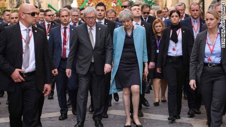 President of the European Union Jean-Claude Juncker and British Prime Minister Theresa May walk between photo calls at a summit in Malta in February.