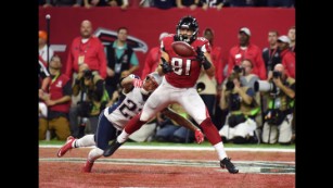 New England Patriots' Julian Edelman is upended by Atlanta Falcons' Philip  Wheeler, bottom, during the first half of the NFL Super Bowl 51 football  game Sunday, Feb. 5, 2017, in Houston. (AP