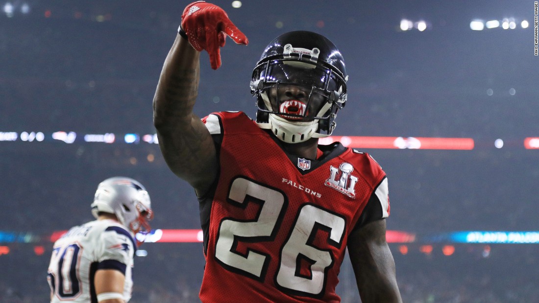 After scoring on a 6-yard touchdown pass in the third quarter, Falcons running back Tevin Coleman celebrates by making an A for Atlanta.