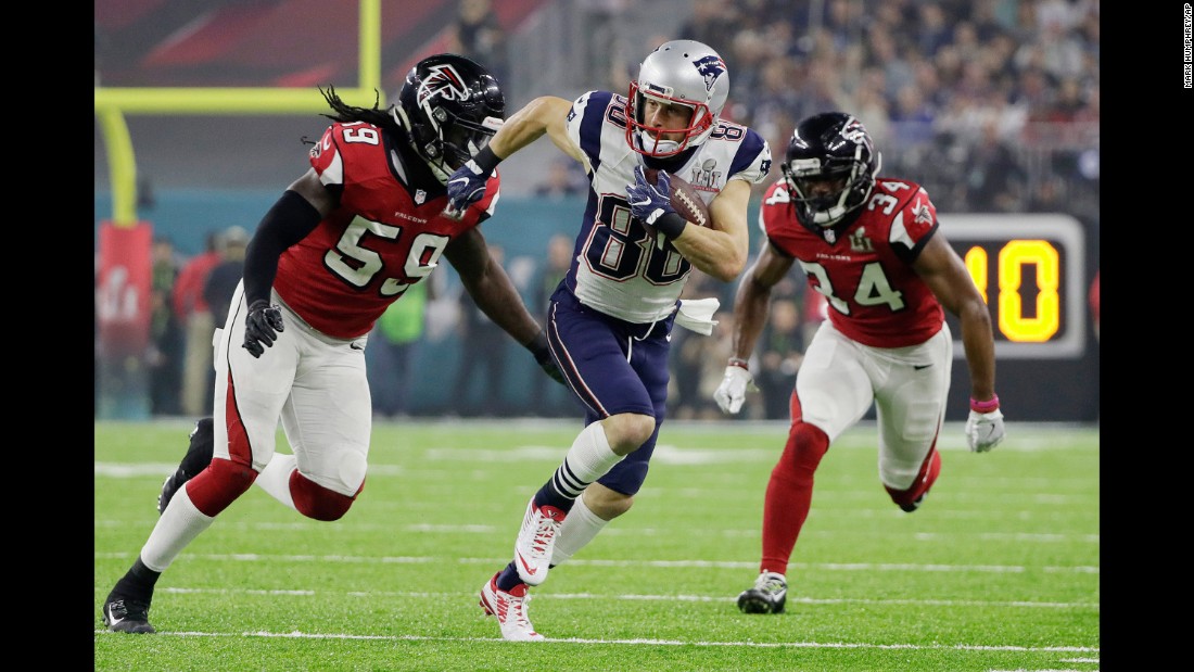 Amendola tries to run past Campbell.