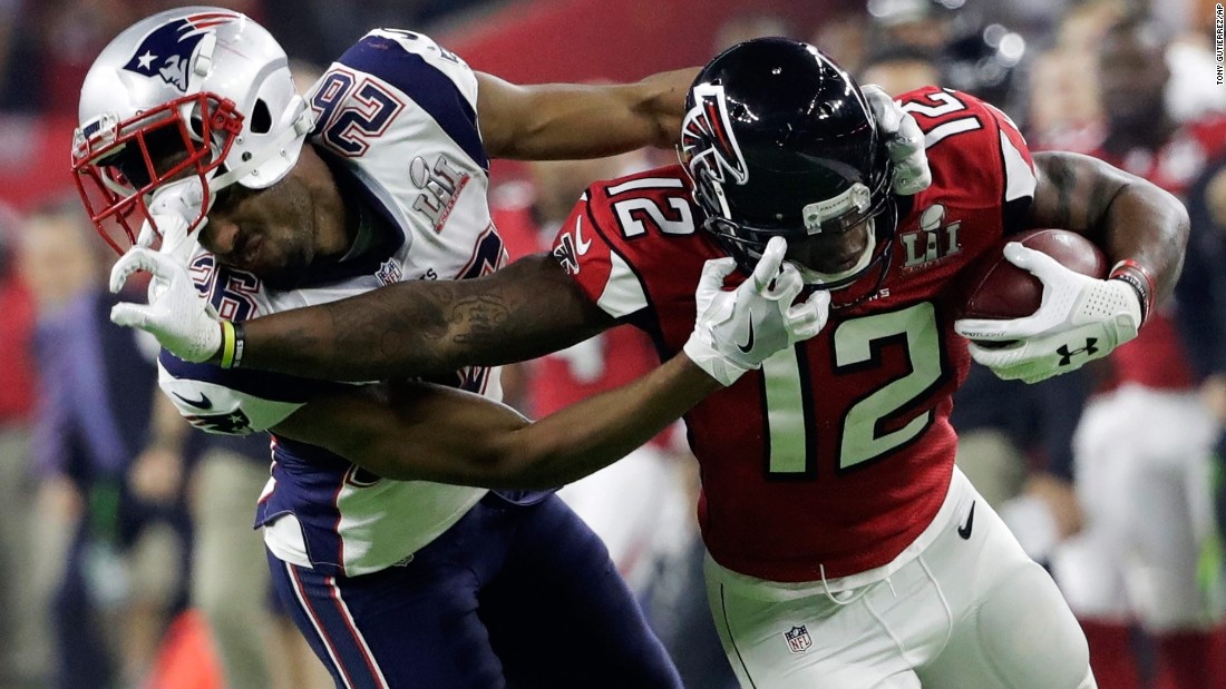 Atlanta wide receiver Mohamed Sanu tussles with New England&#39;s Logan Ryan during the second half.