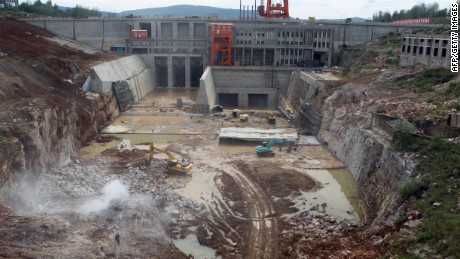 Laborers work on a construction site in September 2013 for the South-to-North Water Diversion plan in central China&#39;s Henan province.