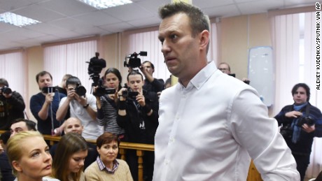 Politician Alexei Navalny, center, waits for Friday&#39;s court hearing in Kirov.