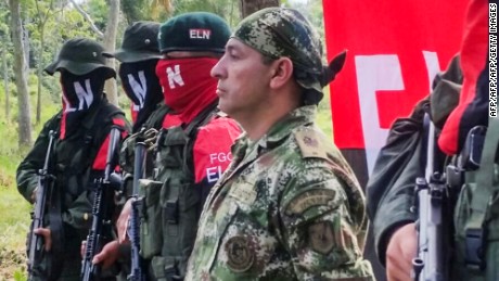 Colombian Soldier Fredy Moreno (R) who was kidnaped by National Liberation Army (ELN), is seen next to ELN members, before his release in Arauca, Colombia on February 6 2017. 

Colombia's ELN rebels freed soldier Fredy Moreno Mahecha in a rural area of Arauca department, in a new goodwill gesture on the eve of peace talks to end a 53-year conflict, the Red Cross said.
 / AFP / Daniel Martinez        (Photo credit should read DANIEL MARTINEZ/AFP/Getty Images)