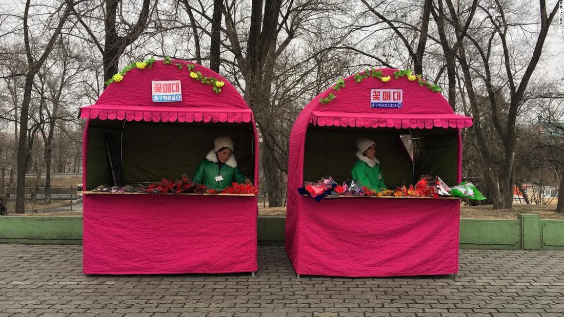 Vendors sell flowers February 15 to mourners paying their respects to deceased leaders of North Korea.