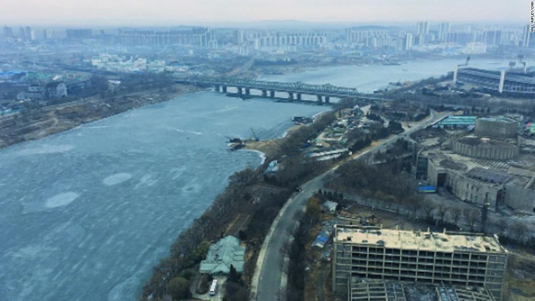 Ice flows down the Taedong River in Pyongyang on February 16.