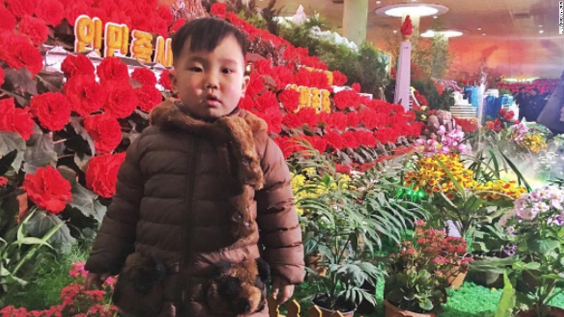 A boy visits the Kimjongilia flower show on February 16. The red flowers are named after the late North Korean leader Kim Jong Il.