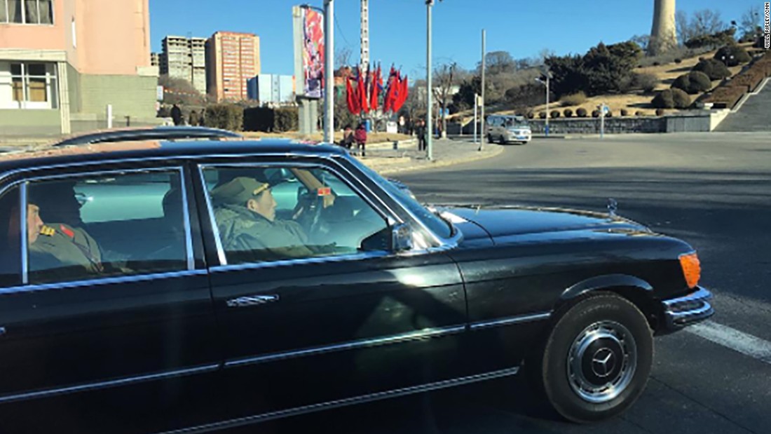 North Korean soldiers ride on February 17, in a black Mercedes-Benz on the streets of Pyongyang.