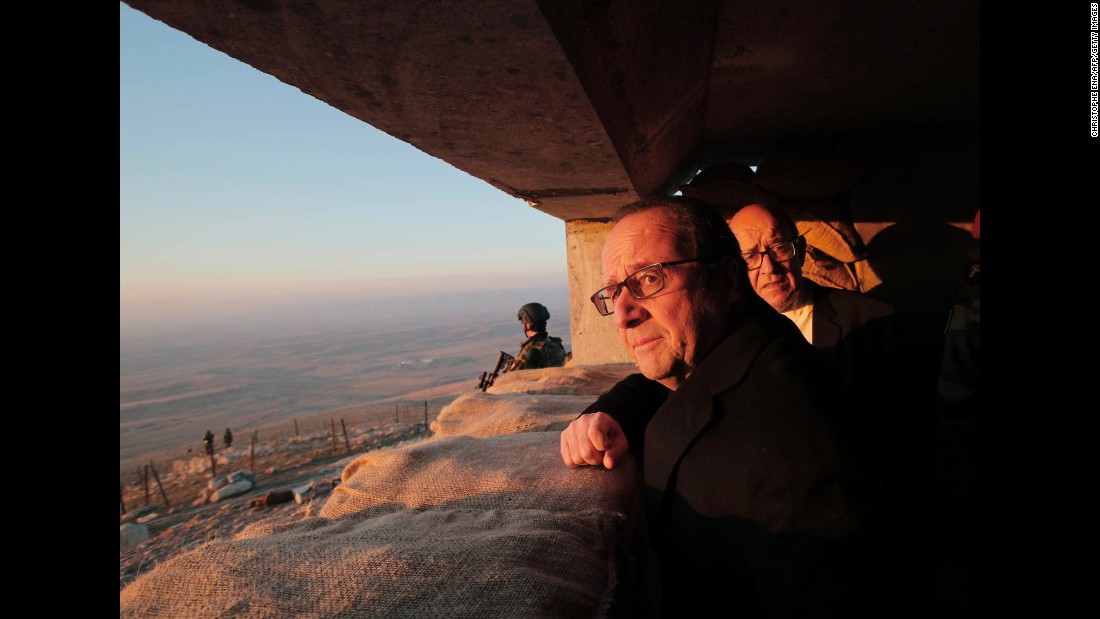 French President Francois Hollande and French Defense Minister Jean-Yves Le Drian, right, view territory held by ISIS during a visit to a military outpost near Mosul on Monday, January 2. 