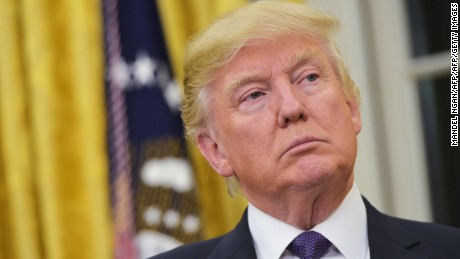 US President Donald Trump watches as Treasury Secretary Steven Mnuchin speaks after taking the oath of office in the Oval Office of the White House on February 13, 2017 in Washington, DC. / AFP PHOTO / MANDEL NGANMANDEL NGAN/AFP/Getty Images