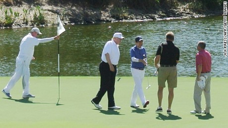 US President Donald Trump and Japan&#39;s Prime Minister Shinzo Abe enjoy playing golf in Florida on February 11, 2017. 