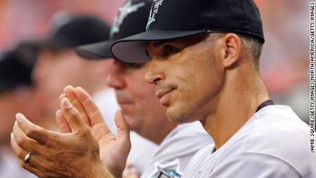 Manager Joe Girardi claps as the Marlins score four runs in the 2nd inning against the Washington Nationals on July 5, 2006, during his brief tenure in Florida.