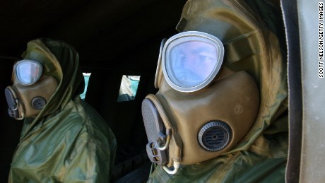 KUWAIT CITY, KUWAIT - DECEMBER 13: Czech soldiers in chemical protection suits take part in a chemical attack response drill conducted at the U.S. Embassy by civil defense authorities and troops from the United States, Germany, and Czech Republic December 13, 2002 in Kuwait City, Kuwait. The exercise, dubbed 'Event Horizon,' was staged to test the coordinated emergency response to a mock attack on the U.S. Embassy in Kuwait by terrorists using deadly sarin nerve gas.