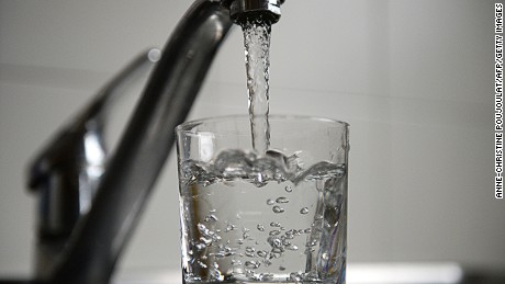 Tap water fills a glass on February 26, 2014 in the French southern city of Marseille. AFP PHOTO/ANNE-CHRISTINE POUJOULAT        (Photo credit should read ANNE-CHRISTINE POUJOULAT/AFP/Getty Images)