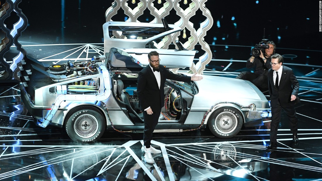 Seth Rogen, left, and Michael J. Fox were on stage together to present an award. Before that, Rogen paid homage to Fox and the &#39;80s film &quot;Back to the Future,&quot; which Rogen said inspired him.