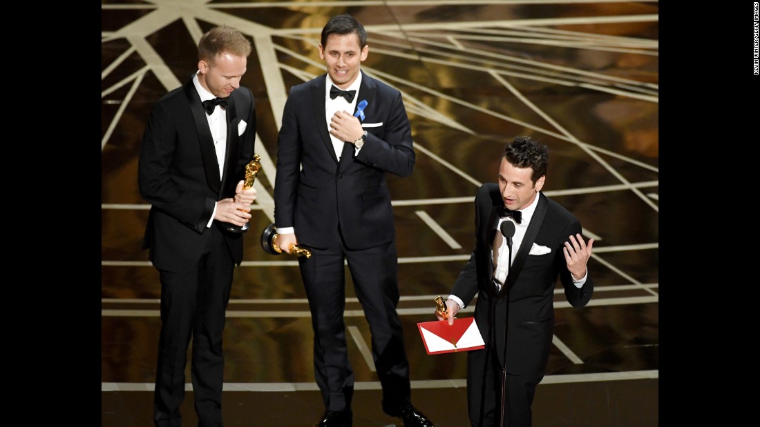 From left, songwriters Justin Paul, Benj Pasek and Justin Hurwitz accept the Oscar for best original song (&quot;City of Stars&quot; from the movie &quot;La La Land&quot;).