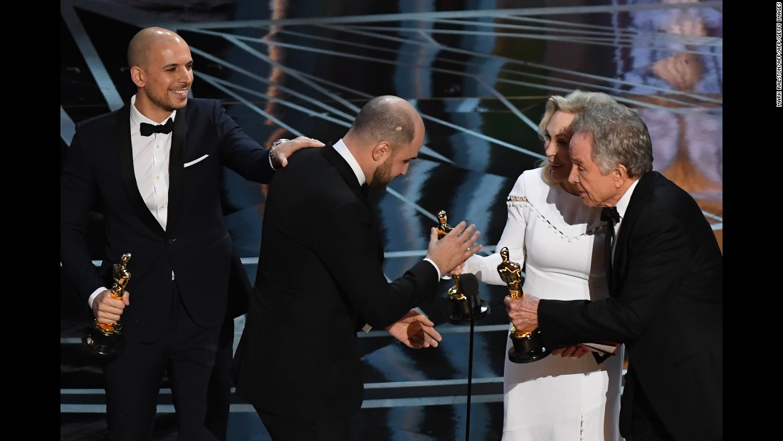 &quot;La La Land&quot; producer Jordan Horowitz, center, accepts the award for best picture next to producer Fred Berger.