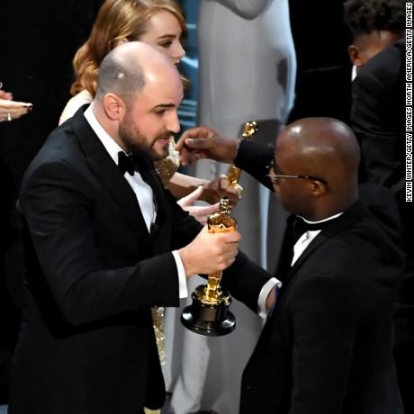HOLLYWOOD, CA - FEBRUARY 26:  &#39;&#39;La La Land&#39; producer Jordan Horowitz (L) hands over the Best Picture award to &#39;Moonlight&#39; writer/director Barry Jenkins following a presentation error onstage during the 89th Annual Academy Awards at Hollywood &amp; Highland Center on February 26, 2017 in Hollywood, California.  (Photo by Kevin Winter/Getty Images)