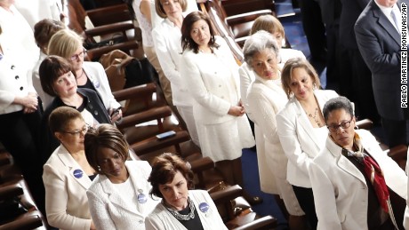 Women Democratic member of Congress, wearing white inn honor of women&#39;s suffrage, watch as President Donald Trump arrives on Capitol Hill in Washington, Tuesday, Feb. 28, 2017, to address a joint session of Congress. (AP Photo/Pablo Martinez Monsivais)