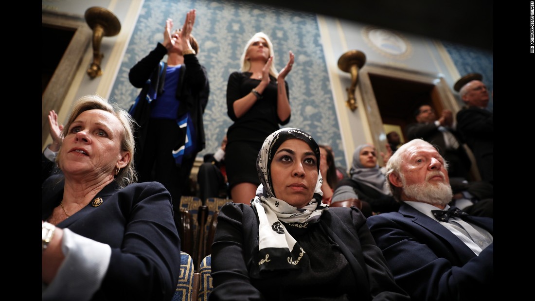 Muslim activist Fauzia Rizvi, a guest of US Rep. Mark Takano, watches Trump&#39;s address.