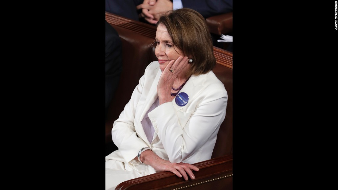 House Minority Leader Nancy Pelosi listens to the speech.